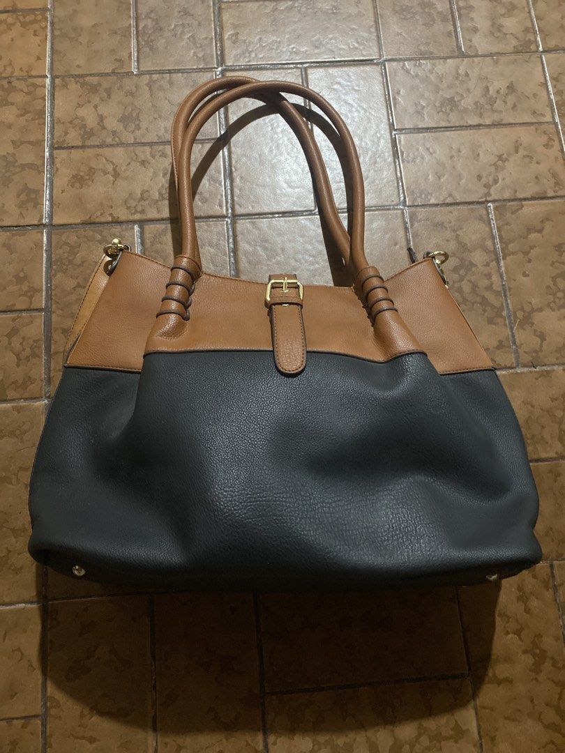 Black Rivet Two-Tone Tote Bag Brown Black (Category: Tote Bags) located in Cainta. Submitted by narraveranda (Listing ID 1460844823, Image 1). Description: .