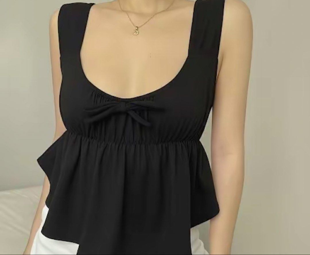 Black Ruffle Peplum Tie Front Crop Top (Category: Sleeveless) located in Manila. Submitted by jamalynnah (Listing ID 1460881107, Image 1). Description: - Ruffled peplum hem - Comfortable wide straps Small to Semi Large.