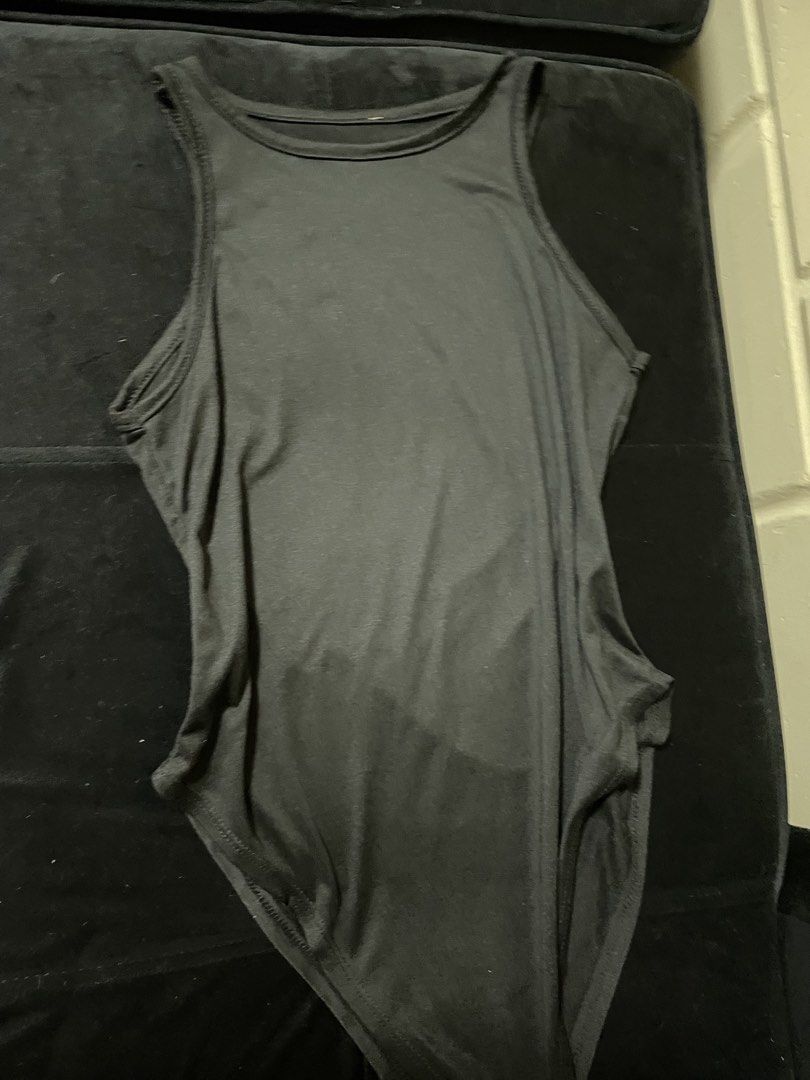 Black Sleeveless Tank Bodysuit with Snap Closure (Category: Sleeveless) located in San Juan, La Union. Submitted by nicaaas (Listing ID 1460823403, Image 3). Description: stretcaheble waist: 24-28 inches no issues - Basic black sleeveless bodysuit - High neckline, tank style - Snap closure at the bottom - Stretchy material for a comfortable fit - Perfect for layering or wearing on its own - A versatile essential for any wardrobe.