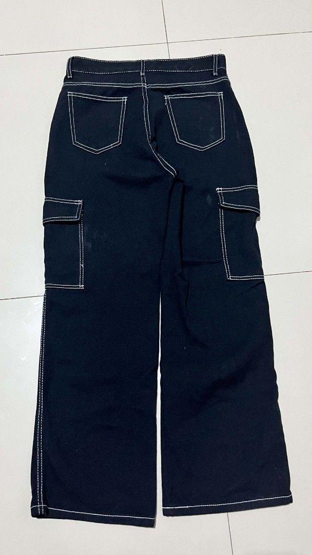 Black Wide Leg Cargo Pants with White Stitching (Category: Other Bottoms) located in Manila. Submitted by sandobag (Listing ID 1460864507, Image 2). Description: Cargo Pants ( Womens) Size: W 29-30 L 38.5 Excellent condition Color rate:10/10 - Black wide leg cargo pants - Contrast white stitching throughout - Multiple pockets on front and sides - Button and zip closure at waist - Relaxed fit, perfect for casual wear.
