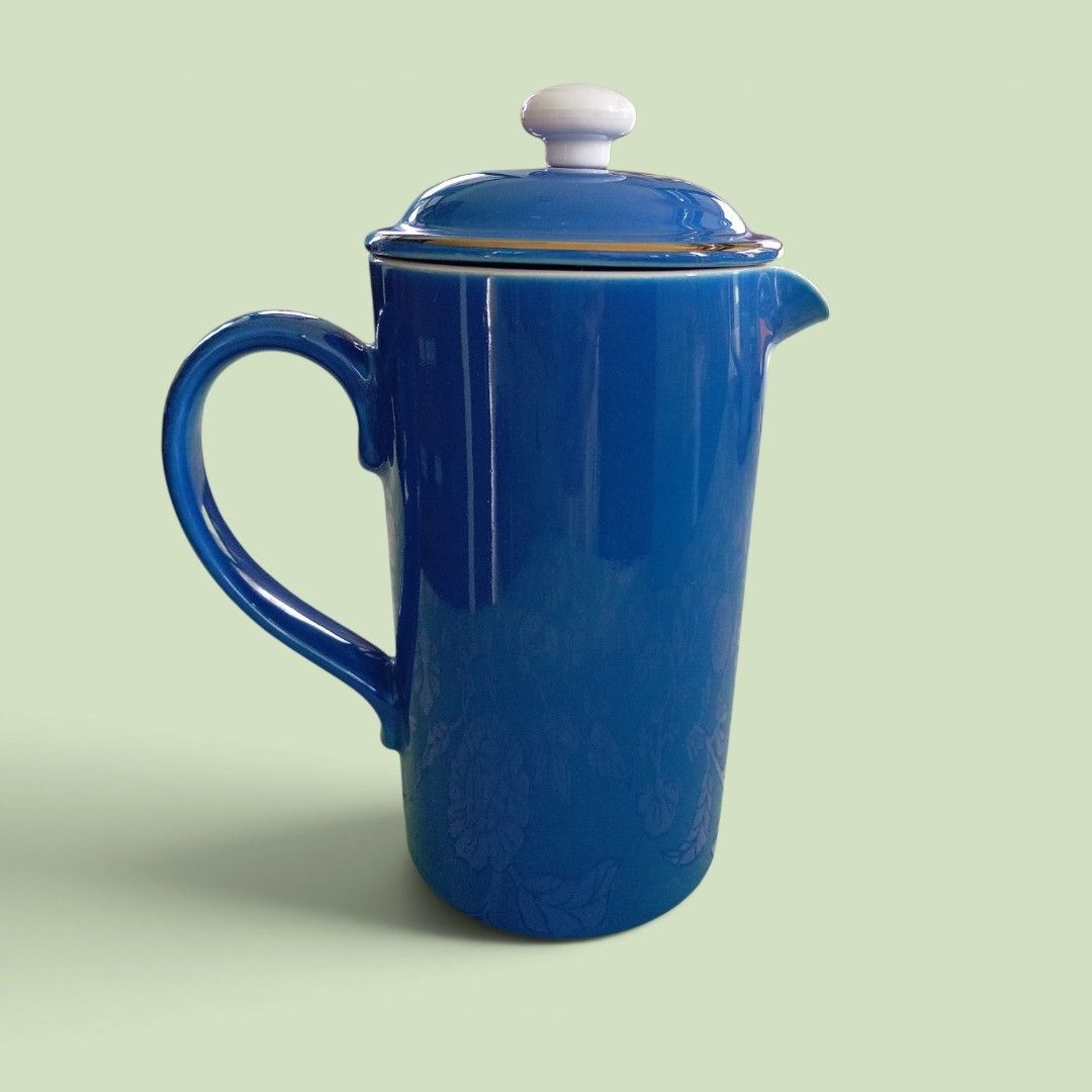 Blue Ceramic French Press (Category: Coffee & Tea Tableware) located in Makati City. Submitted by meowmyella (Listing ID 1460726521, Image 1). Description: - Elegant blue ceramic French press - Comes with a durable stainless steel plunger and lid - Interior is clean white ceramic - Ideal for brewing your favorite coffee or tea - Stands approximately 8 inches tall brand: Cloverleaf England.