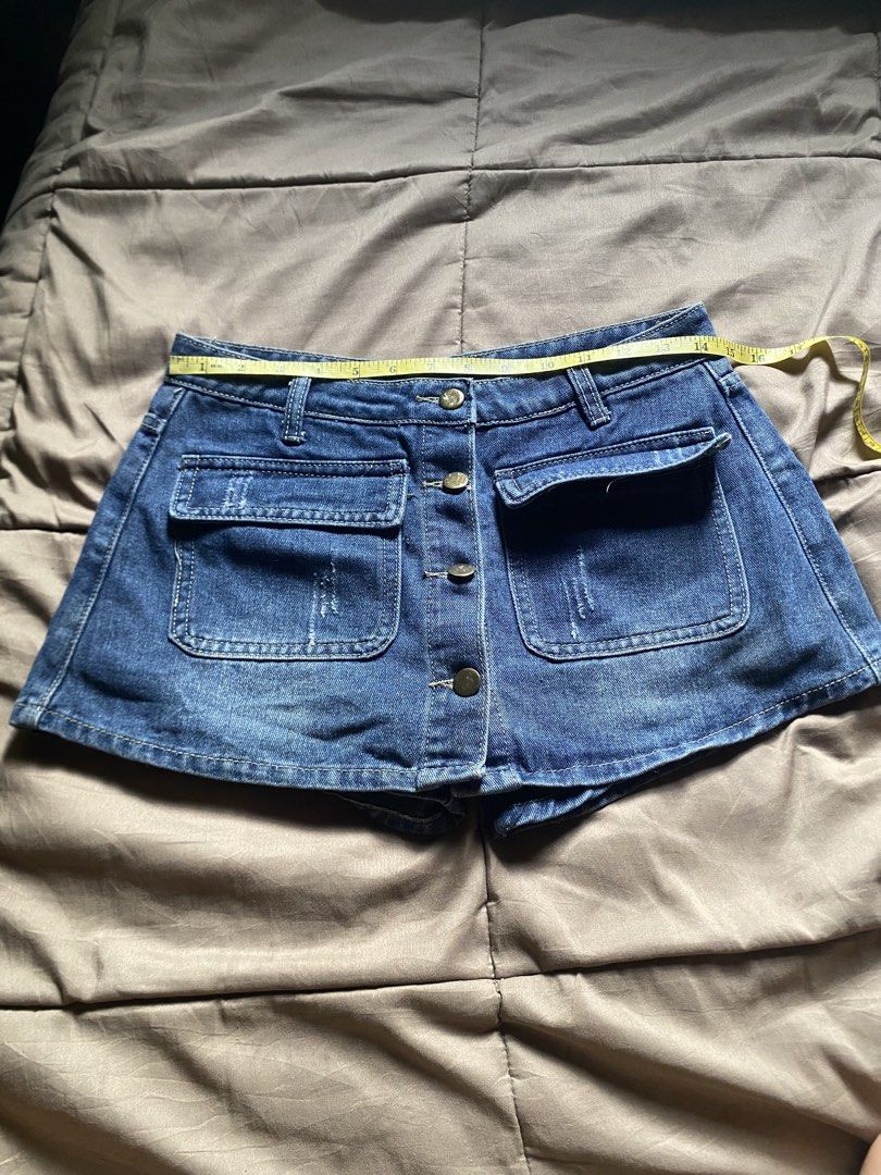 Blue Denim Button-Up Shorts with Pockets (Category: Shorts) located in Caloocan City. Submitted by lienzonius (Listing ID 1460727860, Image 1). Description: - Cute blue denim shorts - Button-up front - Two front pockets - Two back pockets - Distressed pocket details - Waist: Approx. 14 inches - Length: Approx. 11 inches - Ideal for casual wear.