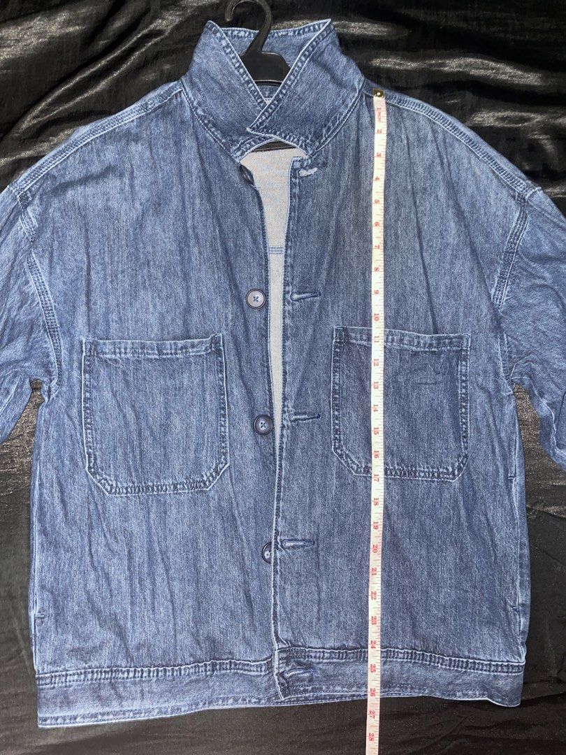 Blue Denim Jacket with Collar (Category: Coats, Jackets and Outerwear) located in Rizal. Submitted by brnlcs.gentle (Listing ID 1460723588, Image 3). Description: - Classic blue denim jacket - Two chest pockets - Button-up front - Unique folded collar design - Ideal for layering - Measurements: 26 inches length 21 inches width Loc: Cainta, Rizal.