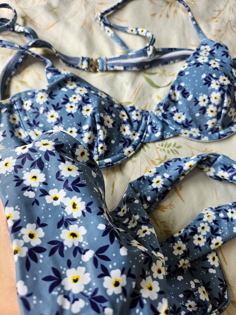 Blue Floral Bikini Set (Category: Bikinis & Swimsuits) located in Pasay City. Submitted by kunin.moto (Listing ID 1460756353, Image 3). Description: Never used. Good quality - Adorable blue bikini - Features a white and yellow floral print - Also includes a fun polka dot pattern - Top has adjustable straps for a perfect fit - Padded - Secure clasp closure on the top - Classic bikini cut bottoms - Ideal for beach days and pool parties.