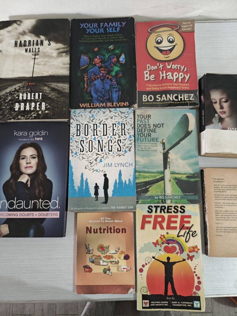 Books for take all (Category: Storybooks) located in Paranaque City. Submitted by anonymoosh (Listing ID 1460909963, Image 2). Description: Selling a bundle of 9 books. Titles include 'Hadrian's Walls', 'Undaunted', 'Your Family Your Self', 'Border Songs', 'Don't Worry, Be Happy', 'Stress Free Life', 'Emma' by Jane Austen, 'Along for the Ride', and 'Nutrition'. Great mix of fiction and non-fiction. Some are paperback, some hardcover. Perfect for 
