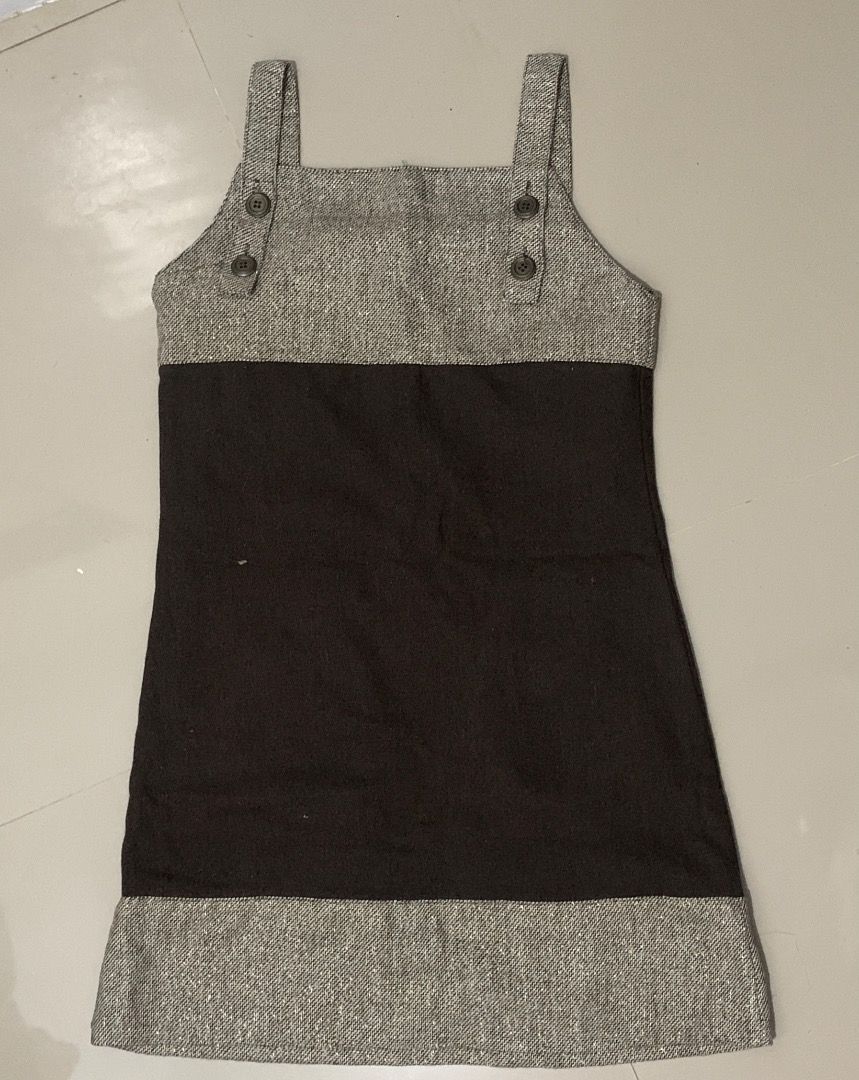 Brown & Tweed Pinafore Dress with Pockets (Category: Dresses) located in Caloocan City. Submitted by missymisskz (Listing ID 1460897364, Image 2). Description: - Adorable pinafore dress - Features a brown fabric bottom half - Tweed fabric on the top and hem - Two functional buttoned pockets on the front - Button details on the straps - Ideal for stylish layering.