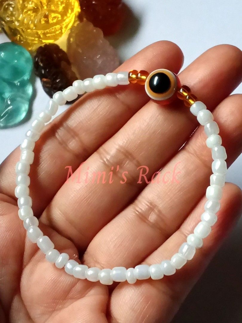Brown Evil Eye in White Seed Beads Bracelet (Category: Bracelets) located in Taguig. Submitted by mimisrack (Listing ID 1460724008, Image 1). Description: 🤎A simple and elegant bracelet featuring a brown evil eye centerpiece surrounded by delicate white seed beads and gold-tone accents. ✨ -The combination of crisp white, warm brown, and gold gives this bracelet a clean yet eye-catching look. 🧿 Evil eye-inspired design traditionally associated w