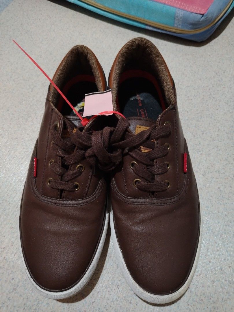 Brown Leather Lace-up Sneakers (Category: Casual Shoes) located in Manila. Submitted by choyxxvi (Listing ID 1460735736, Image 1). Description: Brown leather sneakers with white soles. Classic lace-up style. Red accent detail on the side. Comfortable for everyday wear. Great pair of casual shoes..