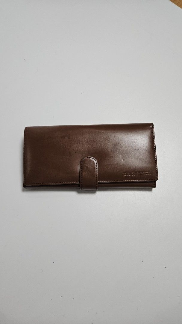 Brown Leather Long Wallet (Category: Wallets & Card holders) located in Alfonso. Submitted by jbcamet (Listing ID 1460829783, Image 1). Description: - mushroom brown leather long wallet - Ample card slots and compartments for organization - Interior zip pocket for coins or small items - Smooth leather with a nice sheen - Secure snap button closure - Perfect for keeping your essentials tidy.