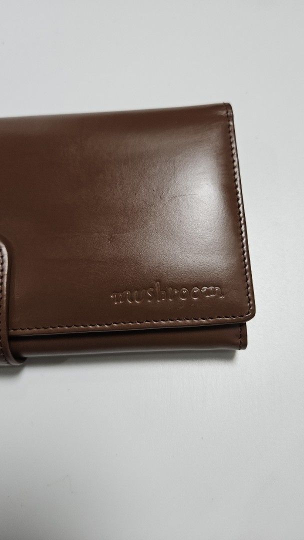 Brown Leather Long Wallet (Category: Wallets & Card holders) located in Alfonso. Submitted by jbcamet (Listing ID 1460829783, Image 3). Description: - mushroom brown leather long wallet - Ample card slots and compartments for organization - Interior zip pocket for coins or small items - Smooth leather with a nice sheen - Secure snap button closure - Perfect for keeping your essentials tidy.