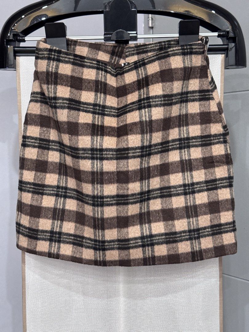 Calliope Brown Plaid Mini Skirt (Category: Skirts) located in Manila. Submitted by altabl123 (Listing ID 1460882717, Image 1). Description: - Cute brown plaid mini skirt - Feels like a wool blend - Ideal for fall and winter seasons - Versatile styling with boots or sneakers - Perfect for casual outings or school days.