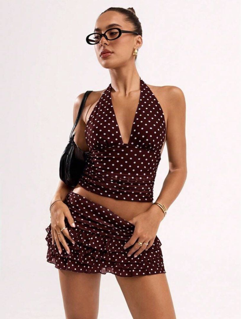 Brown Polka Dot Halter Top & Mini Skirt Set (Category: Sets or Coordinates) located in Manila. Submitted by iaious (Listing ID 1460743737, Image 2). Description: - Cute brown halter top with white polka dots - Matching mini skirt included - Both pieces are lightweight and flowy - Ideal for summer or a night out - Top features a deep V-neck and ties at the neck - Skirt has a ruffled hem - Versatile styling with sandals or heels.