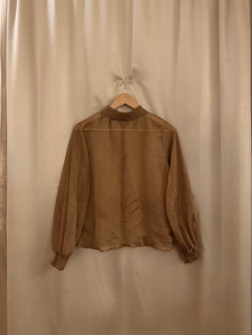 Brown sheer puff sleeve high neck top (Category: Blouses) located in Manila. Submitted by 414studio (Listing ID 1460897128, Image 1). Description: Fits medium.