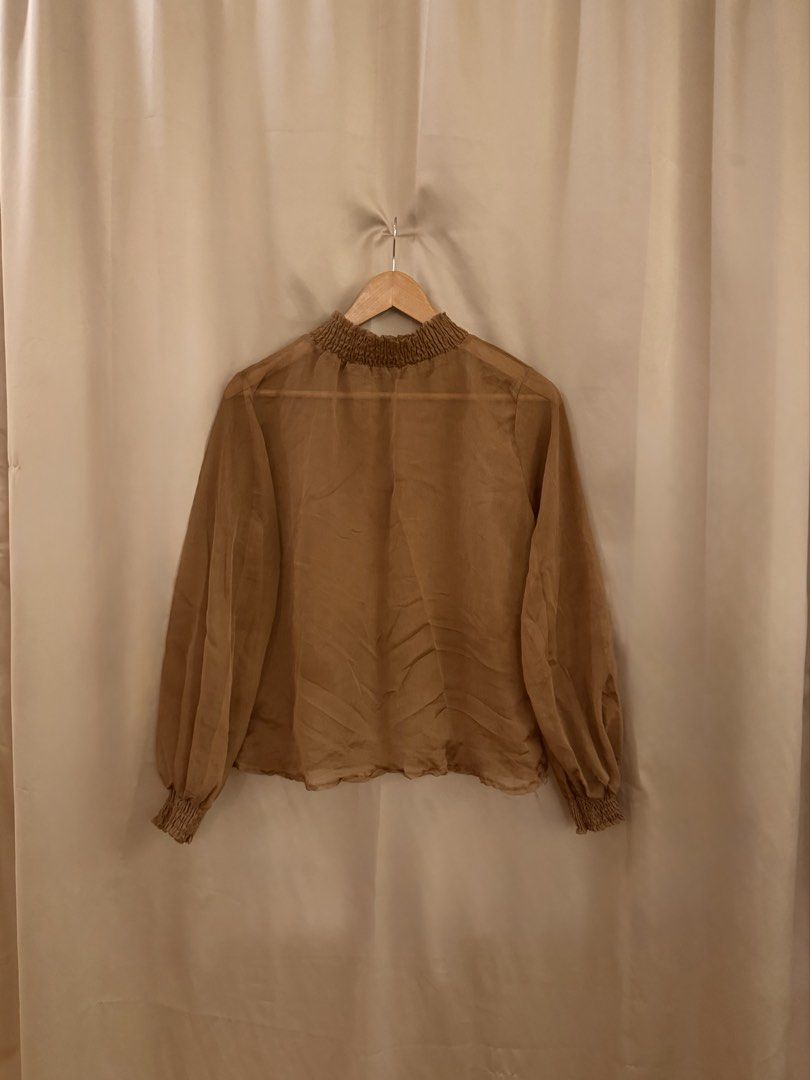 Brown sheer puff sleeve high neck top (Category: Blouses) located in Manila. Submitted by 414studio (Listing ID 1460897128, Image 3). Description: Fits medium.