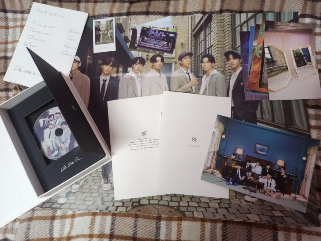 BTS BE Album Deluxe Edition (Category: CDs & DVDs) located in Quezon City. Submitted by jannahbanana21 (Listing ID 1460893615, Image 2). Description: Album Inclusions: - 1 CD - 2 Photobooks - 8 Photocards - 7 Postcards - 1 Polaroid - 1 Poster - 1 Photo Frame - Lyric Poster.