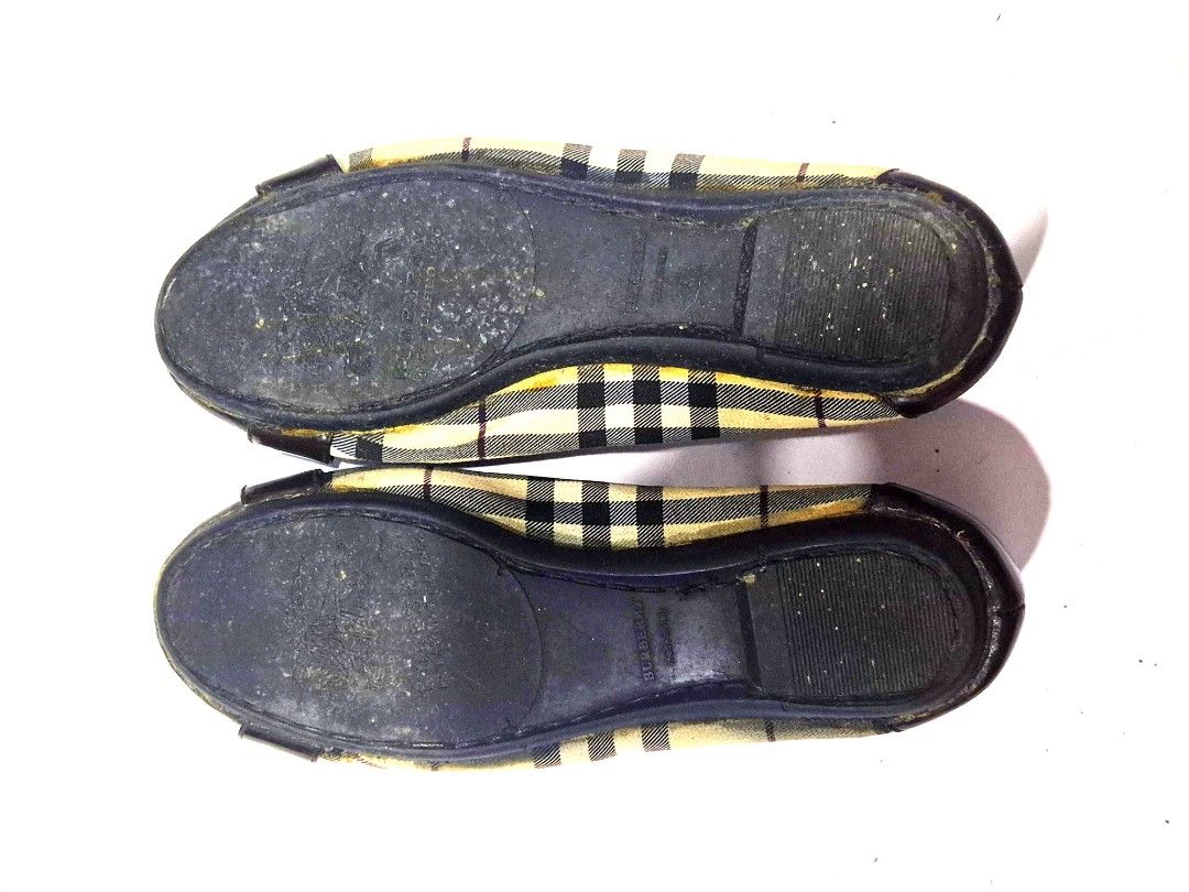 Burberry Nova Check Ballet Flats 7M (Category: Flats & Sandals) located in Antipolo. Submitted by saribymonica (Listing ID 1460899834, Image 3). Description: - Classic Burberry flats - Iconic nova check pattern - Patent toe cap with bow detail - Soles show some wear - Inner lining has some tearing - Great for everyday wear.
