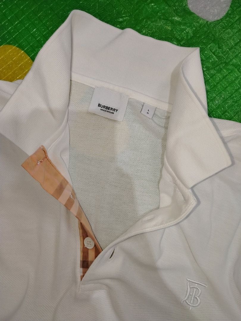 Burberry Polo Shirt (Category: Tshirts & Polo Shirts ) located in Dasmarinas. Submitted by amthriftmixph.2001 (Listing ID 1460731319, Image 2). Description: BRAND: Burberry SIZE: Large DIMES: 21" Width x 28" Length CONDITION: 9/10 COLOR RATE: 9/10 TAGS: With Brand Tags ISSUE: None.