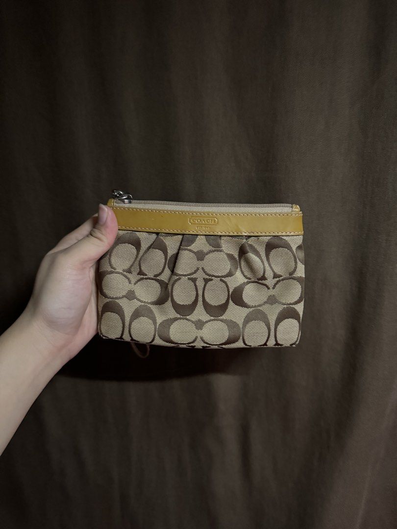 c🍒ach wristlet (Category: Wallets & Card holders) located in Lingayen. Submitted by kuromibunn (Listing ID 1460844817, Image 1). Description: Coach Signature Wristlet*🤎 Classic brown/beige monogram canvas with mustard leather trim Silver-tone hardware with zip closure Comes with detachable wrist strap Condition: Pre-owned with minor signs of wear Description: Stylish and compact wristlet, perfect for carrying your everyday essentials. .