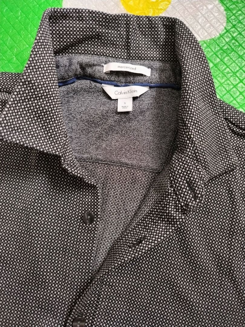 Calvin Klein Buttondown (Category: Tshirts & Polo Shirts ) located in Dasmarinas. Submitted by amthriftmixph.2001 (Listing ID 1460720566, Image 2). Description: BRAND: Calvin Klein SIZE: Small DIMES: 18.5" Width x 28" Length CONDITION: 9.5/10 COLOR RATE: 9.5/10 TAGS: With Brand Tags ISSUE: None.