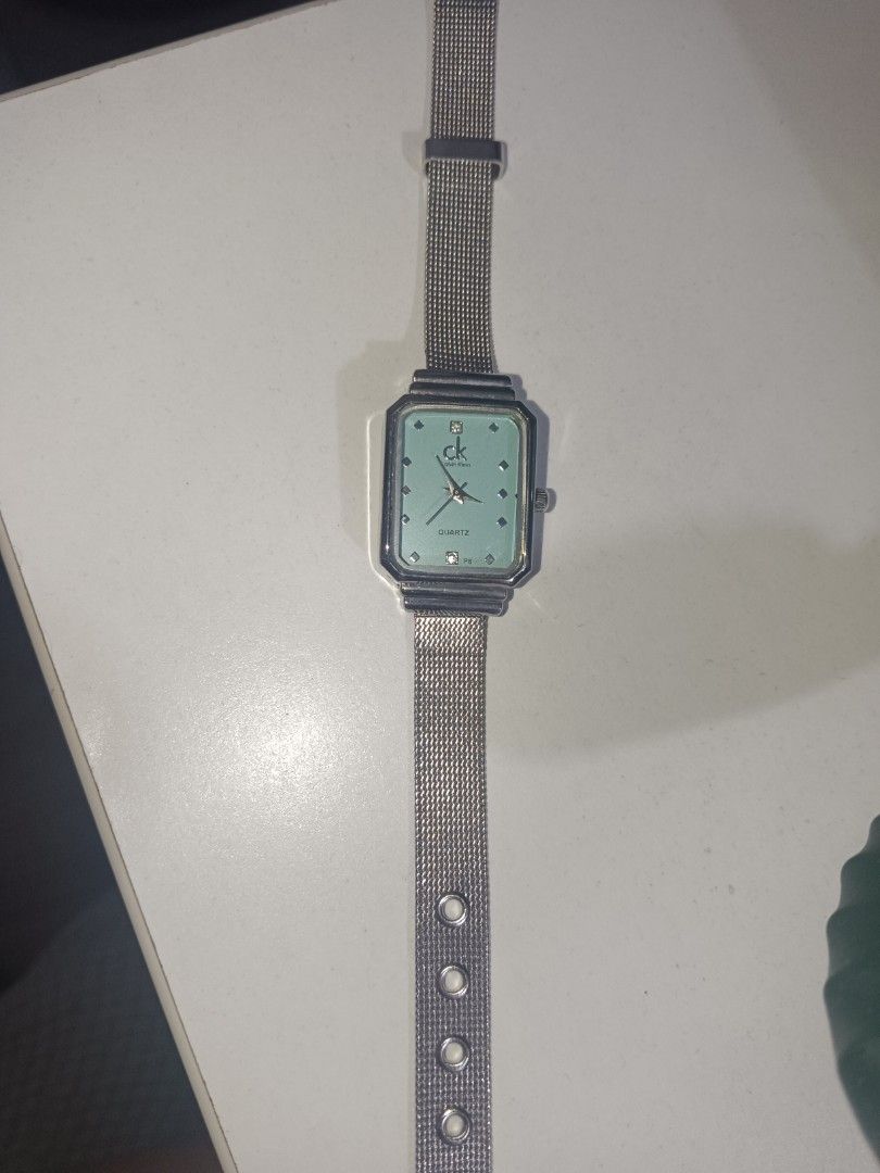 Calvin Klein Quartz Watch - Mint Green Face (Category: Women's Watches) located in Manila. Submitted by clover_co. (Listing ID 1460881486, Image 1). Description: - Elegant Calvin Klein watch - Beautiful mint green watch face - Sparkling stone hour markers - Stylish silver mesh strap - Durable stainless steel back - In excellent working condition .
