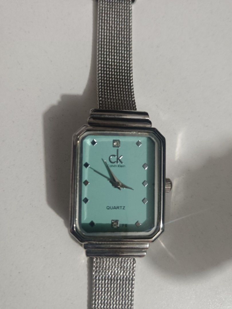 Calvin Klein Quartz Watch - Mint Green Face (Category: Women's Watches) located in Manila. Submitted by clover_co. (Listing ID 1460881486, Image 2). Description: - Elegant Calvin Klein watch - Beautiful mint green watch face - Sparkling stone hour markers - Stylish silver mesh strap - Durable stainless steel back - In excellent working condition .
