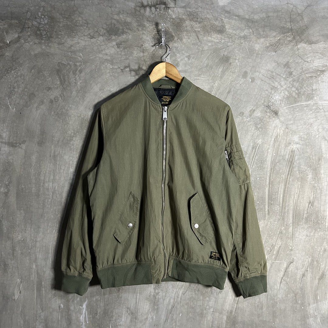 Carhartt - Nylon Bomber Jacket (Category: Coats, Jackets and Outerwear) located in Tayabas. Submitted by streetdepartment (Listing ID 1460904917, Image 1). Description: Carhartt - Nylon Bomber Jacket Measurements (inches): Width: 22.5” Length: 25.5” Tagged as Medium Good condition Flaw/s: fadings on upper part .