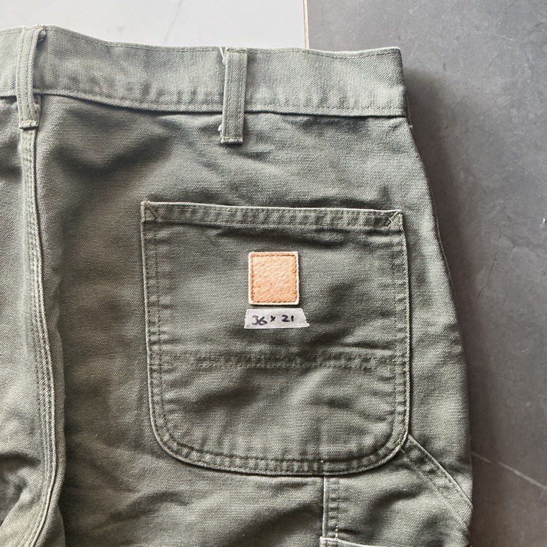 Carhartt Moss Carpenter Jorts (Category: Shorts) located in Santa Barbara. Submitted by evrysundayvintage (Listing ID 1460748942, Image 2). Description: Carhartt Carpenter Jorts Altered length (from pants to jorts) Faded patch Need wash Dimensions Waist: 36” Length: 21” Leg hole: 12”.