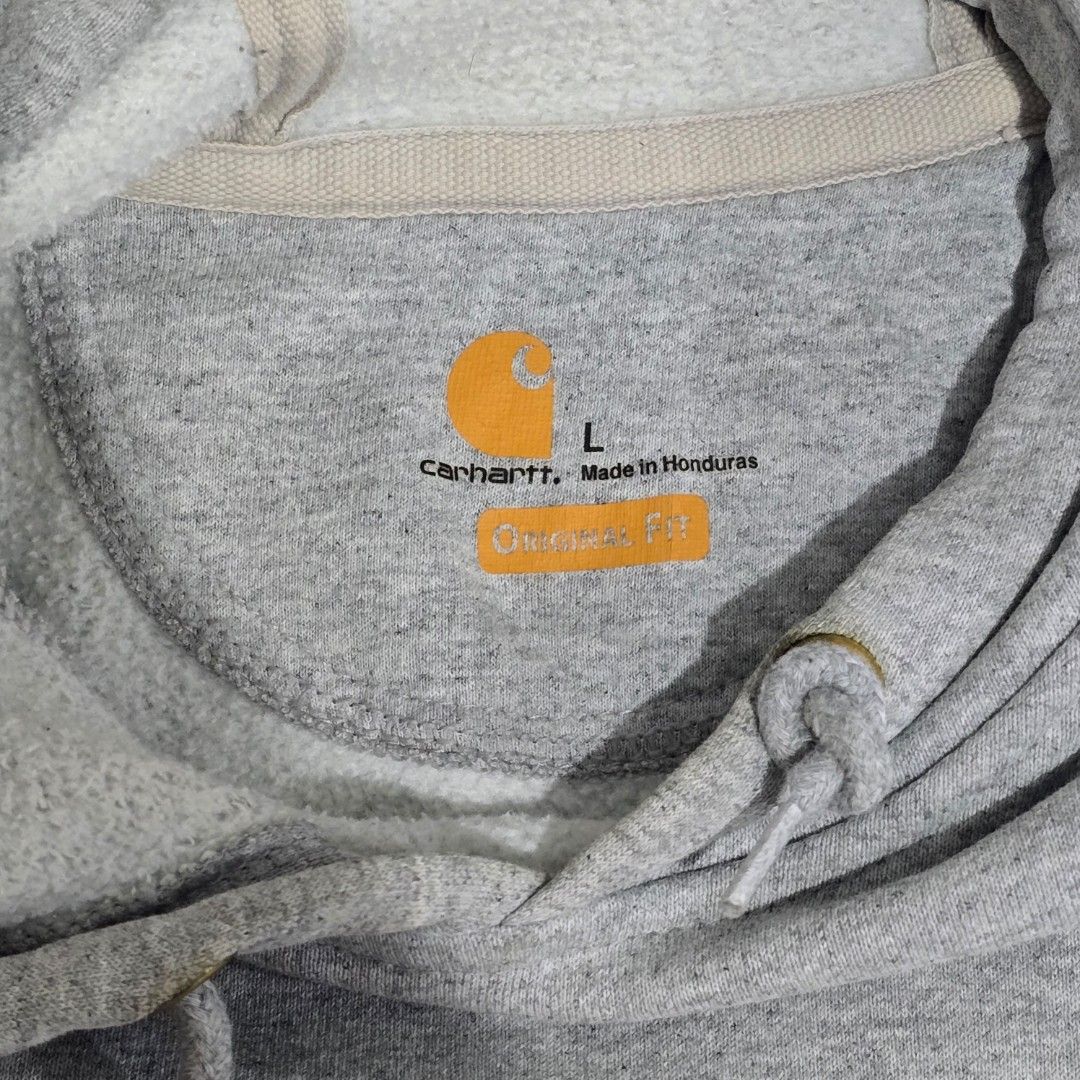Carhartt Pullover Hoodie with sleeve logo (Category: Coats, Jackets and Outerwear) located in Manila. Submitted by nnthrift_ (Listing ID 1460869445, Image 2). Description: Heather grey Carhartt midweight sleeve-logo pullover hoodie (Style #K288), tagged width 25" x length 30" (approximate US XL/2XL fit).