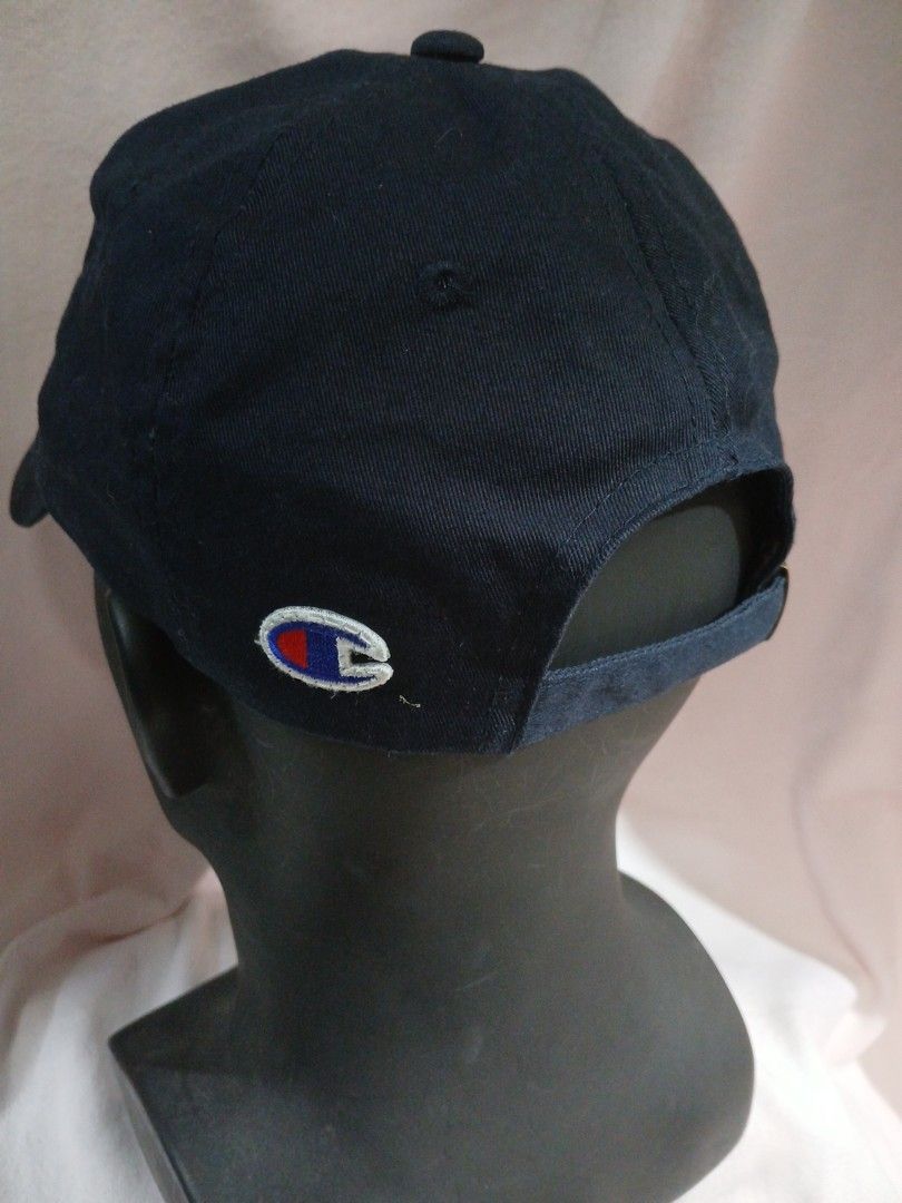Champion Cap (Category: Caps & Hats) located in La Trinidad. Submitted by dashopperist (Listing ID 1460773043, Image 3). Description: - Classic navy blue Champion cap - Iconic embroidered Champion logo on front - Adjustable strap for a comfortable fit - Made with durable material - Perfect for everyday wear or sports activities.