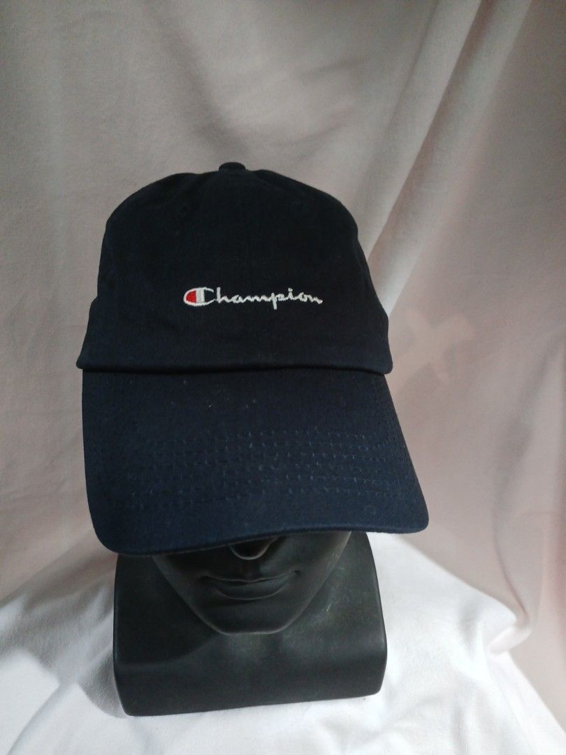 Champion Cap (Category: Caps & Hats) located in La Trinidad. Submitted by dashopperist (Listing ID 1460773043, Image 1). Description: - Classic navy blue Champion cap - Iconic embroidered Champion logo on front - Adjustable strap for a comfortable fit - Made with durable material - Perfect for everyday wear or sports activities.