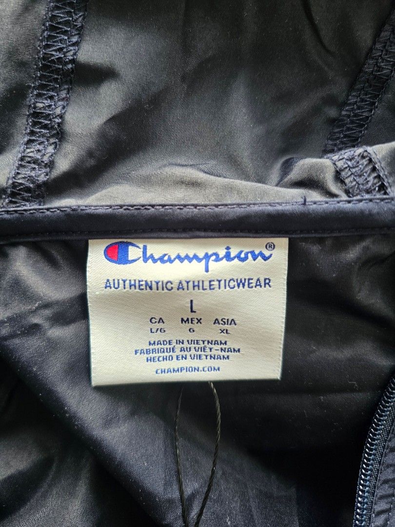 Champion Men's Stadium Packable Anorak Jacket (Category: Coats, Jackets and Outerwear) located in Baguio. Submitted by kayeonlineshop (Listing ID 1460740455, Image 3). Description: -Champion Packable Windbreaker in navy blue -Weather Resistance: Cut from a lightweight, wind-resistant, and water-resistant micro-poplin fabric layer designed to protect against light rain and sudden wind gusts -measurements included in the photos.