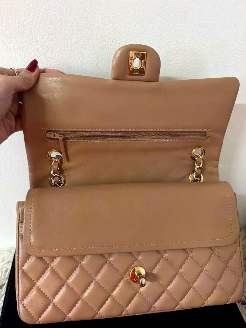 Chanel (Category: Luxury Bags & Wallets) located in Caloocan City. Submitted by mylove326 (Listing ID 1460826869, Image 3). Description: - Chanel Classic Flap Bag -Medium size double flap - Color: Beige - Hardware: Gold - Design: Quilted - Interior: Zip pocket, card slots - Includes: Authenticity card, dust bag, double box - Approximate Measurements: 25.5cm (L) x 14. 5m (H) x 7cm (W) 1-2times lang nagamit. Medyo nagfade lang ung sa max closure sa