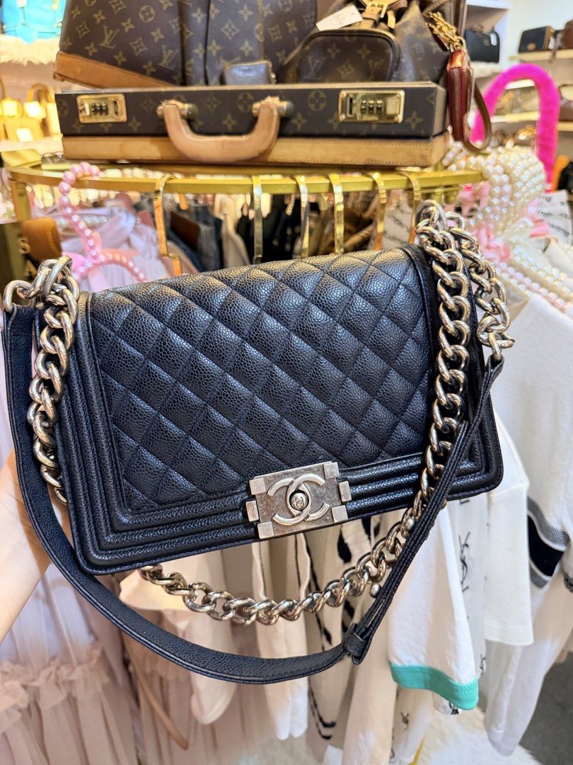 Chanel Black Quilted Leather Boy Bag (Category: Luxury Bags & Wallets) located in Dumaguete. Submitted by lovebags.ph (Listing ID 1460886078, Image 1). Description: - Classic Chanel Boy bag - Black caviar leather - Iconic diamond quilting - Chunky silver chain - Signature CC turn-lock closure - Timeless and versatile for day or night - Spacious interior for essentials Preloved from 🇰🇷.