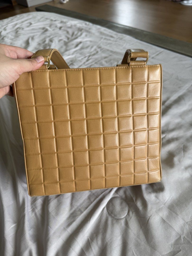 Chanel Chocobar Cream Tote (Category: Luxury Bags & Wallets) located in Calamba. Submitted by mom2girls (Listing ID 1460758797, Image 2). Description: Bag only. No inclusions. Kept in very good condition. The back part of the zipper end needs stitching. Otherwise, not an issue since you place that part inside the bag. See last 2 photos. Shipping via LBC only. SF c/o Buyer.