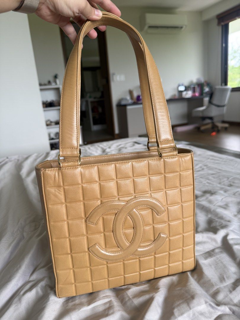 Chanel Chocobar Cream Tote (Category: Luxury Bags & Wallets) located in Calamba. Submitted by mom2girls (Listing ID 1460758797, Image 1). Description: Bag only. No inclusions. Kept in very good condition. The back part of the zipper end needs stitching. Otherwise, not an issue since you place that part inside the bag. See last 2 photos. Shipping via LBC only. SF c/o Buyer.