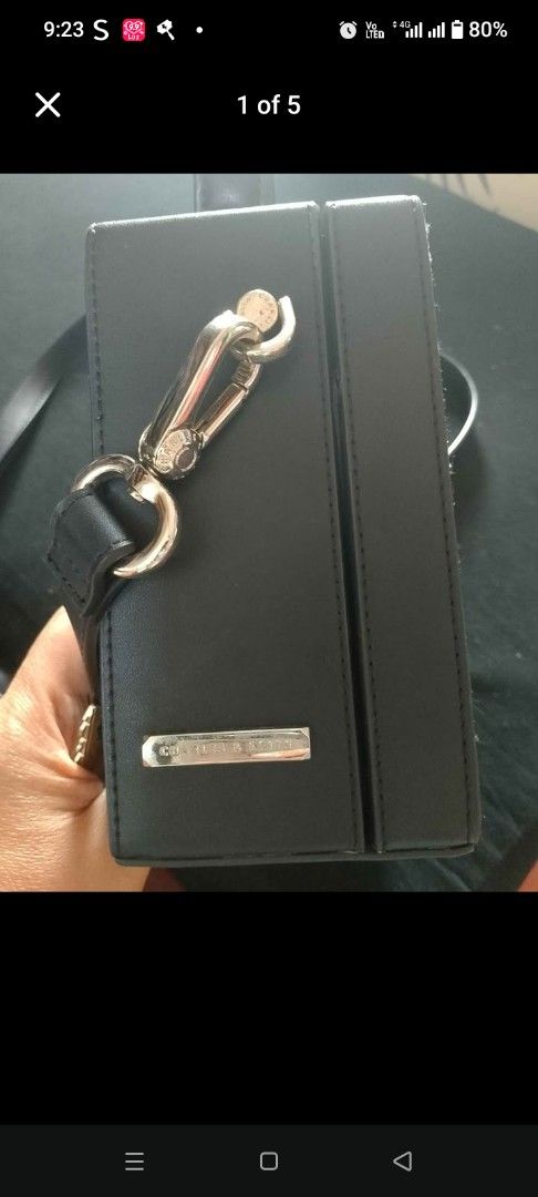 Charles & Keith Black Handbag (Category: Luxury Bags & Wallets) located in Talisay. Submitted by clover2626 (Listing ID 1460723587, Image 1). Description: - Brand: Charles & Keith - Color: Black - Features: Silver clasp, silver strap attachment - Style: Clean, chic, versatile - Ideal for: Everyday use or special occasions.