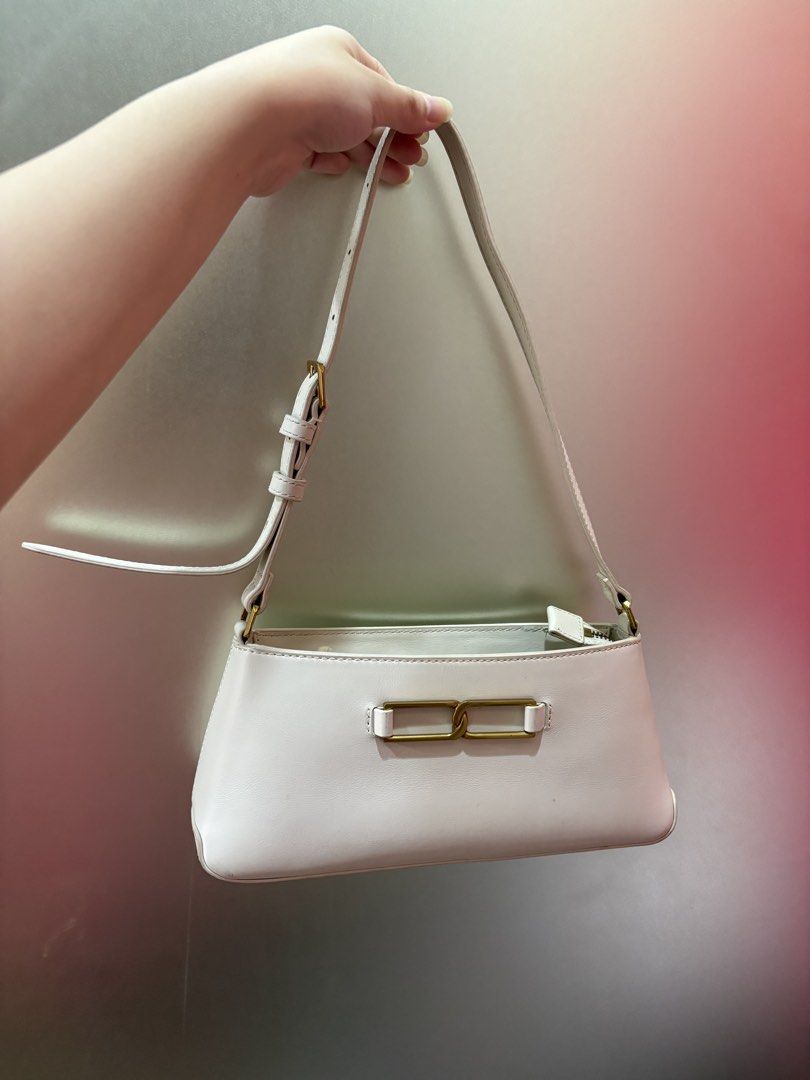 Charles & Keith White Shoulder Bag with Gold Hardware (Category: Luxury Bags & Wallets) located in Manila. Submitted by curatedclosetbyj (Listing ID 1460763983, Image 1). Description: - White Charles & Keith shoulder bag - Features a stylish gold buckle detail on the front - NOTE: well used (has lipstick stains inside the bag) .