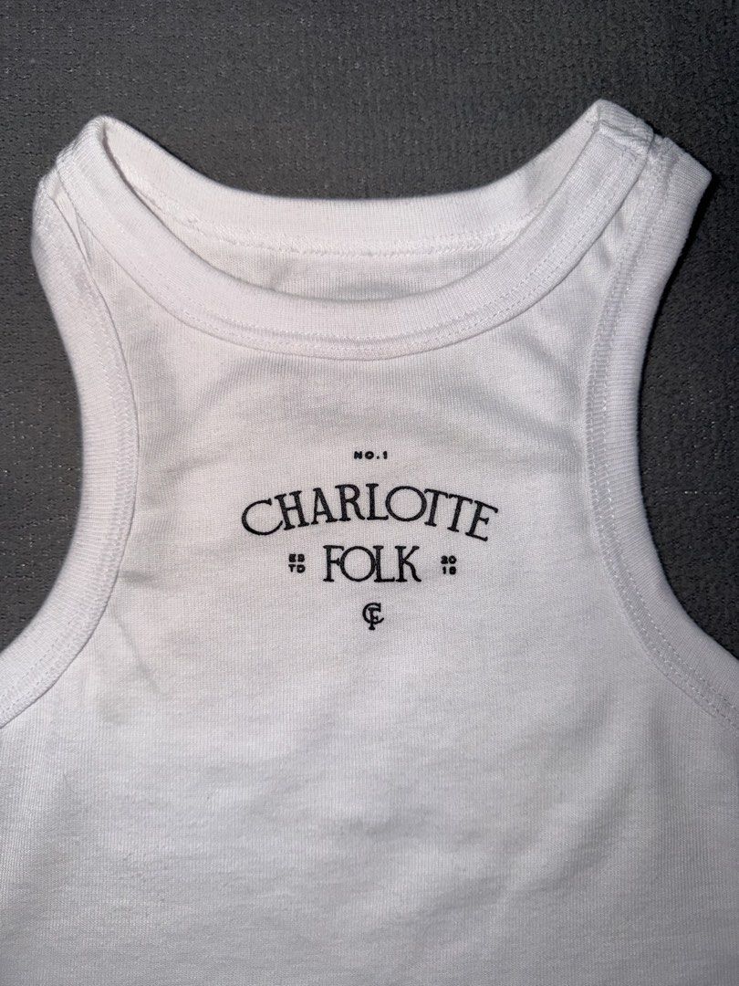 Charlotte Folk White Tank Top (Category: Sleeveless) located in Quezon City. Submitted by spicycalimaki (Listing ID 1460766870, Image 2). Description: - size M - last price posted 🏷️ zara h&m mango uniqlo monki cotton on urban revivo bershka pull & bear love bonito editors market shein tiktok richboyz.