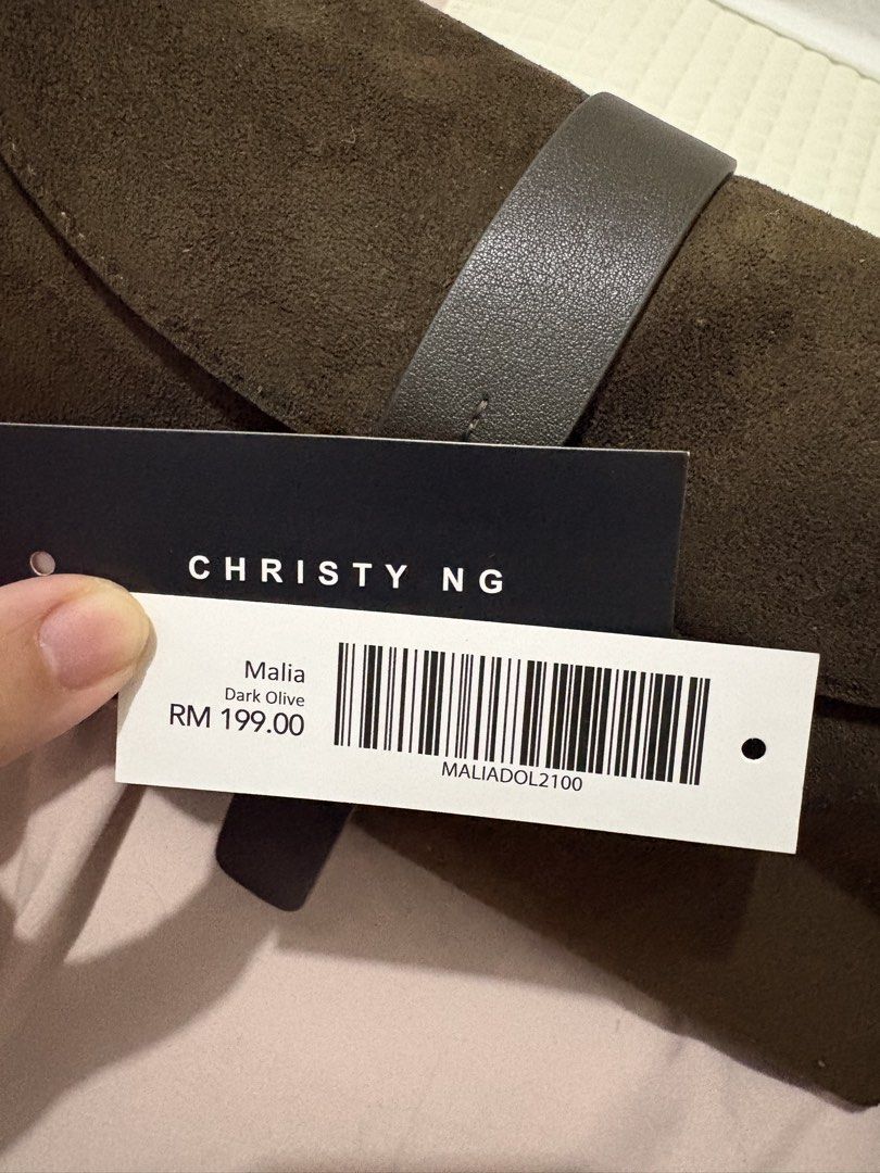 Christy Ng Bag (Category: Luxury Bags & Wallets) located in Makati City. Submitted by max_lilo (Listing ID 1460907370, Image 2). Description: Christy Ng Malia Bag in Dark Olive Suede Material Two Way - Shoulder and Sling Bag Used once only No issues, like new condition Bought for ₱3699.