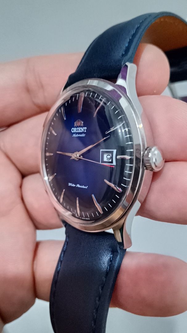 Classic Orient Bambino Version 4 Automatic Dress Watch (Category: Men's Watches) located in Malolos. Submitted by chrono_revival (Listing ID 1460781265, Image 3). Description: PLEASE READ THE FULL POST BEFORE SENDING ANY INQUIRIES. SERIOUS OFFERS ONLY PLEASE. ********** Authentic Orient Bambino V4 Automatic Watch - Sunburst blue dial - All original, will also include the original strap, as seen on the last photo - Case size: approx. 42mm - Condit