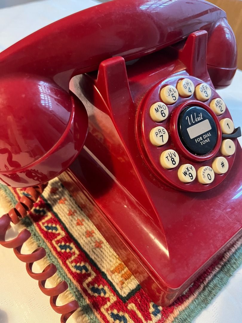 Classic Red Rotary Dial Telephone (Category: Vintage Collectibles) located in Binan City. Submitted by maxgrande (Listing ID 1460869021, Image 2). Description: - Classic red rotary dial phone - Ideal for retro decor or as a prop - Features a coiled cord - Includes 'Wait for Dial Tone' indicator - A unique piece for collectors or home styling .