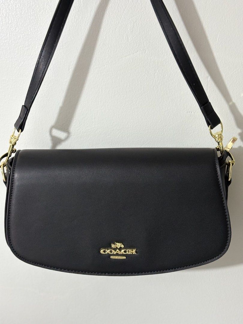Coach Black Leather Shoulder Bag with Gold Hardware (Category: Luxury Bags & Wallets) located in Abucay. Submitted by erindeclutterss (Listing ID 1460816969, Image 1). Description: • 2-way bag, can be worn as a shoulder bag or sling bag. with free strap included. • with Box and Dust Bag •rfs already got the same bag but in different color •nego!! .