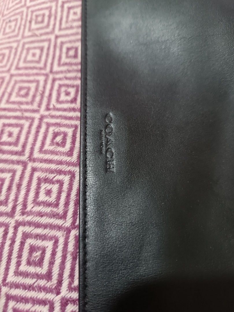 Coach Black Leather Zip Around Clutch Wallet (Category: Luxury Bags & Wallets) located in Las Pinas. Submitted by mitchmiko16 (Listing ID 1460916461, Image 2). Description: - Authentic Coach black leather clutch - Secure zip-around closure with gold hardware - Embossed Coach logo on zipper pull - Spotless interior - Ideal for organizing daily essentials or as a travel pouch.