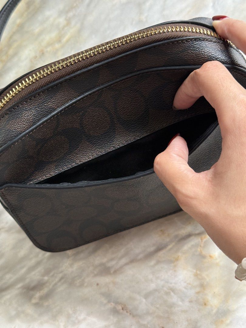 Coach Crossbody Bag (Category: Cross-body Bags) located in San Mateo. Submitted by aifoslvdr (Listing ID 1460719544, Image 3). Description: - brown cross-body bag - multiple pockets/compartments inside - can fit (any) iPhone Pro Max - rfs: decluttering.