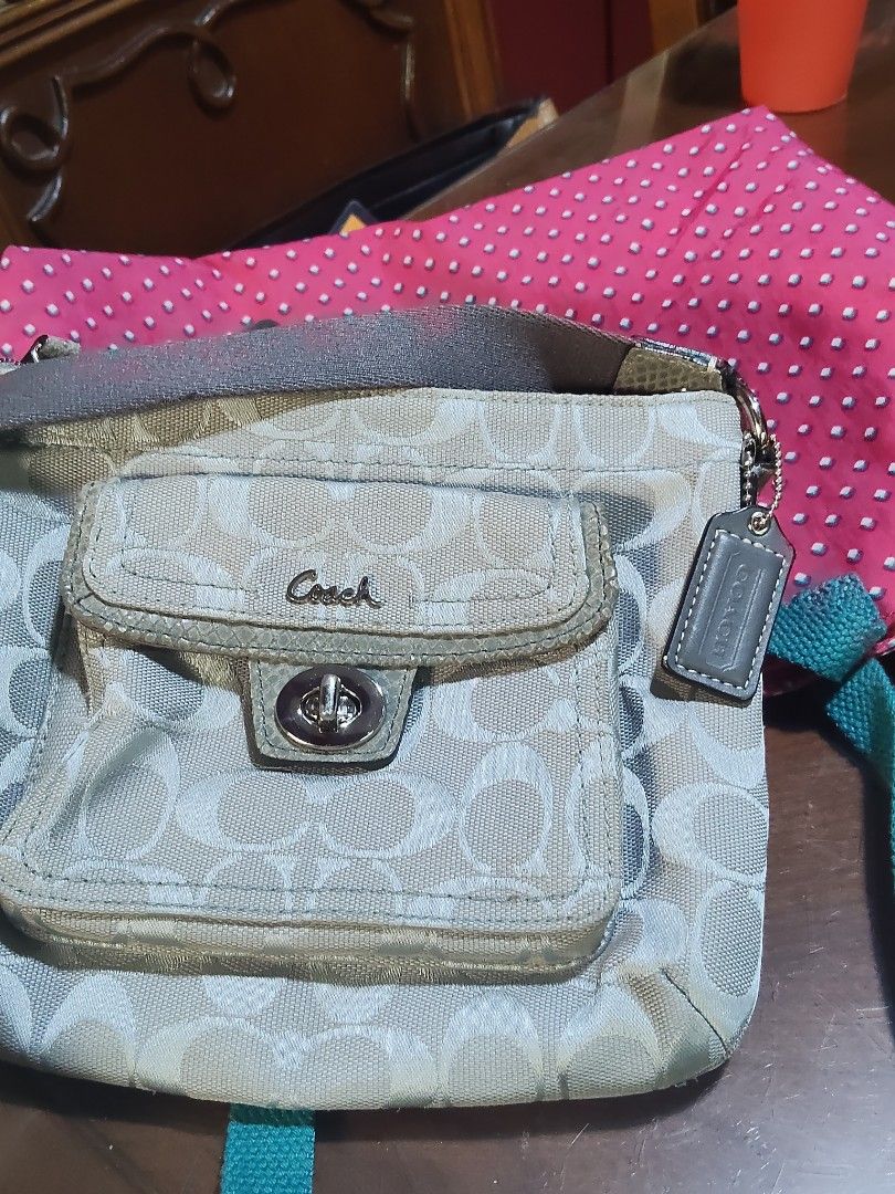 Coach Monogram Canvas Crossbody Bag (Category: Cross-body Bags) located in Cebu City. Submitted by almzcorner (Listing ID 1460865601, Image 2). Description: - Coach crossbody bag - Signature monogram pattern in tan and cream - Front flap pocket with secure turn-lock closure - Interior lined with light purple fabric - Adjustable strap for customized comfort - Ideal for everyday errands and outings.