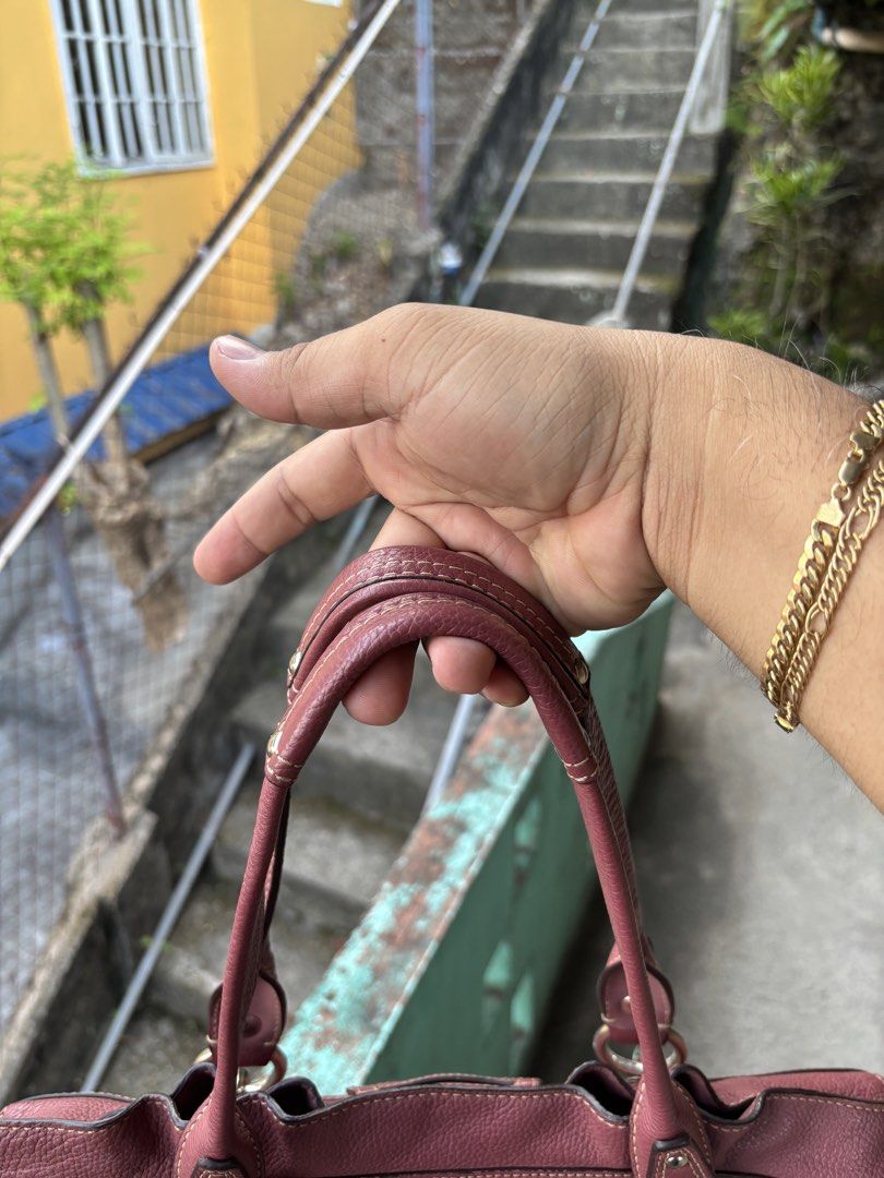 Coach Penelope Pebbled Leather Shoulder Bag (Category: Shoulder Bags) located in Cebu City. Submitted by jhon32closetfinds (Listing ID 1460917149, Image 3). Description: This appears to be a Coach Penelope Pebbled Leather Shoulder Bag in a soft mauve pink, accented by distinct silver-tone hardware on the dual shoulder straps.