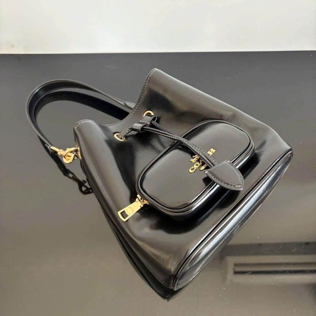 Coach Rowan Bucket Pocket in Black (Category: Cross-body Bags) located in Quezon City. Submitted by bagsboutiqueph (Listing ID 1460870249, Image 2). Description: LAST PRICE POSTED. LIMITED STOCKS! BRANDNEW WITH INCLUSIONS. COLOR MAY SLIGHTLY VARY IN ACTUAL DUE TO LIGHTING AND CAMERA SETTING. OTHER PHOTOS WILL BE SEND DURING PURCHASE AND FOR SURE BUYERS ONLY. WHEN IN DOUBT, DO NOT ORDER. THANK YOU..