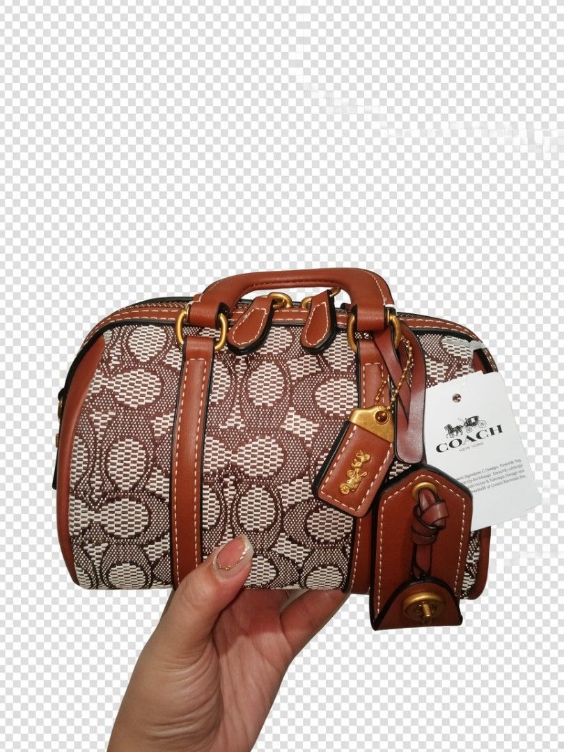 Coach Signature Monogram Barrel Bag (Category: Cross-body Bags) located in Quezon City. Submitted by borresashl49573 (Listing ID 1460870471, Image 1). Description: - Authentic Coach barrel bag😍 - Signature monogram print♥️ - Tan leather trim and handles - Secure zipper closure - Interior zip pocket and card slots - Comes with Coach hang tag - Includes leather charm♥️.