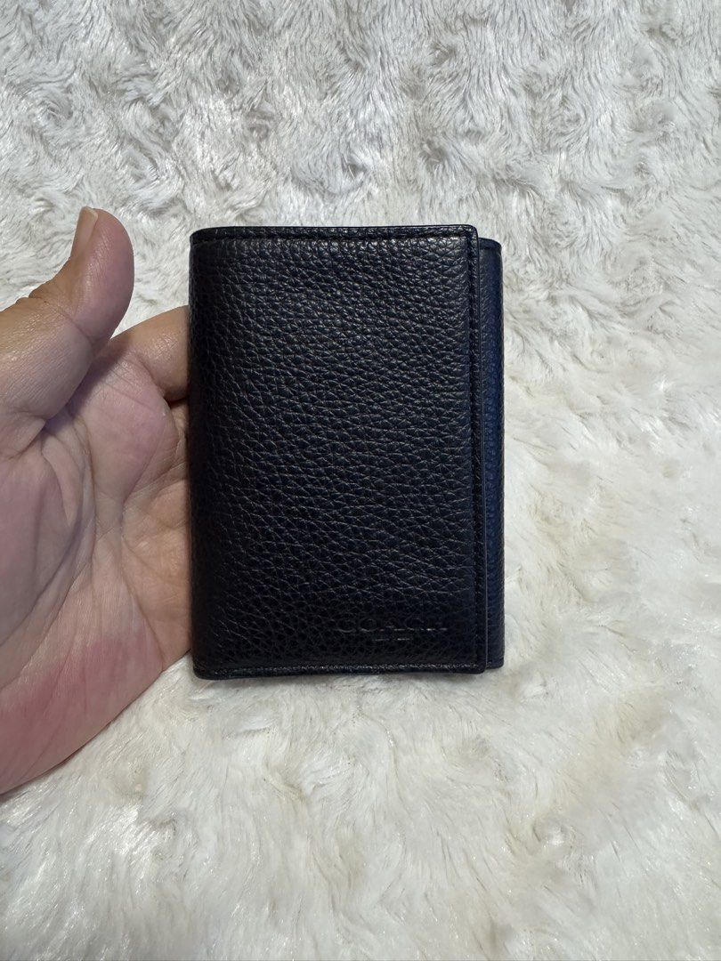Coach Trifold Wallet Pebble Leather Navy (Category: Wallets & Card holders) located in Carmona. Submitted by outletshopper.ph (Listing ID 1460808630, Image 1). Description: - Black Coach trifold wallet - Made from genuine pebble leather - Ample card slots for organization - Compact and pocket-friendly size - Ideal for everyday use - Interior is clean and well-maintained.