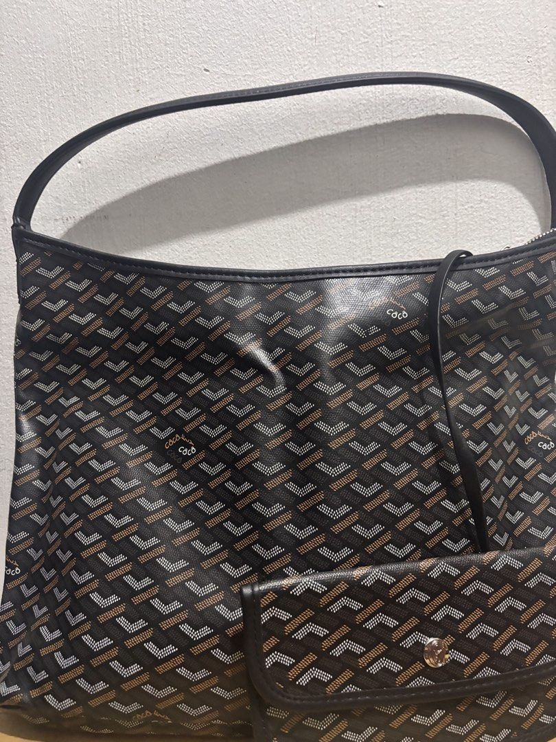 Coco fly Hobo Bag with Pouch (Category: Luxury Bags & Wallets) located in Manila. Submitted by ssgvillal34630 (Listing ID 1460721989, Image 2). Description: - Features iconic chevron pattern - Comes with a matching pouch inside - Zipper closure - Leather handles - Great for everyday use - Still in original plastic packaging.